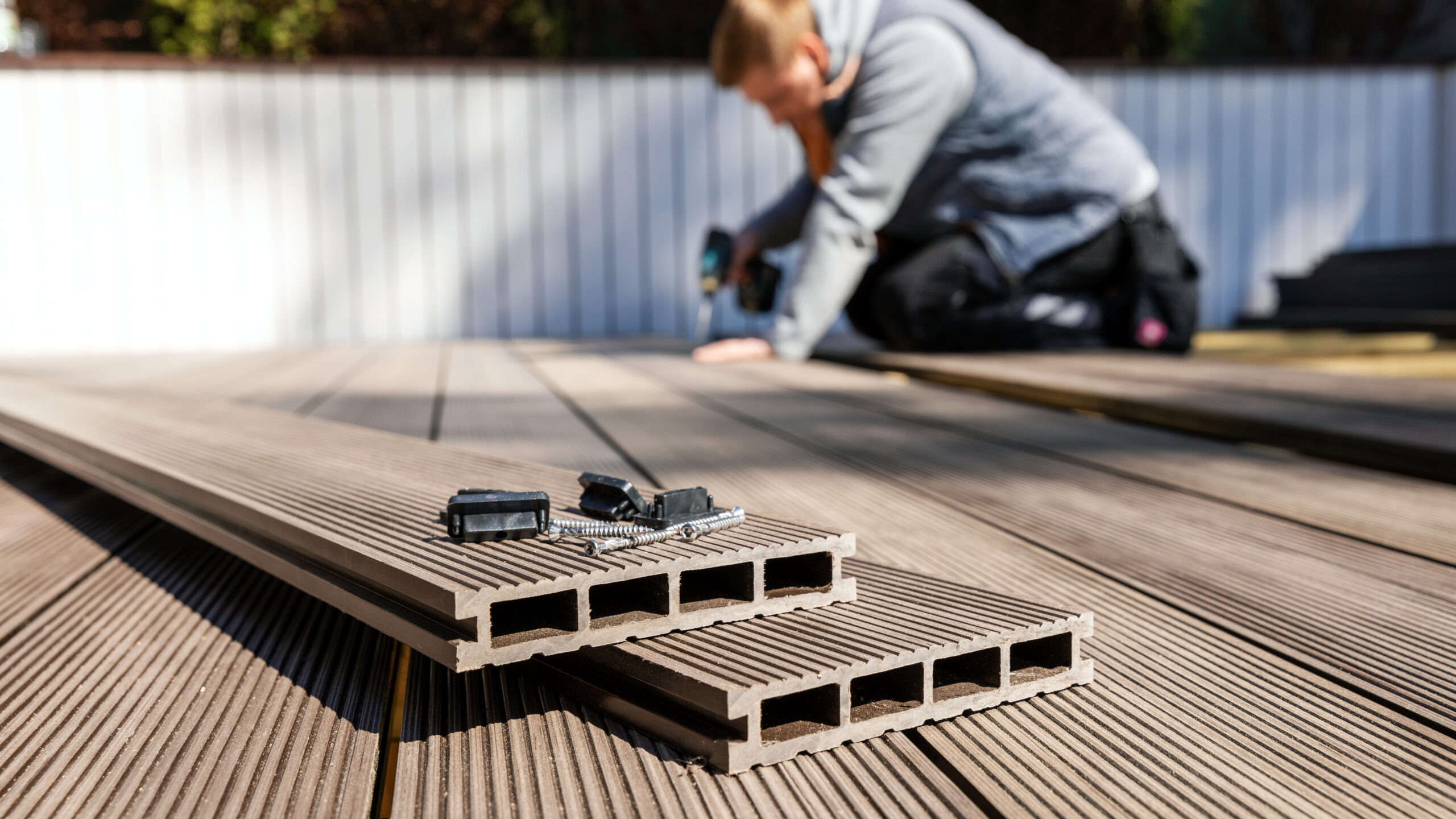 Wpc,Terrace,Construction,-,Worker,Installing,Wood,Plastic,Composite,Decking