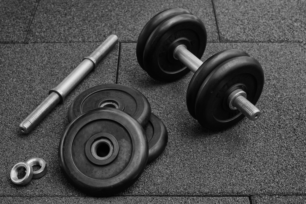 Dumbbell,And,Iron,Plates,On,The,Rubber,Floor,In,The